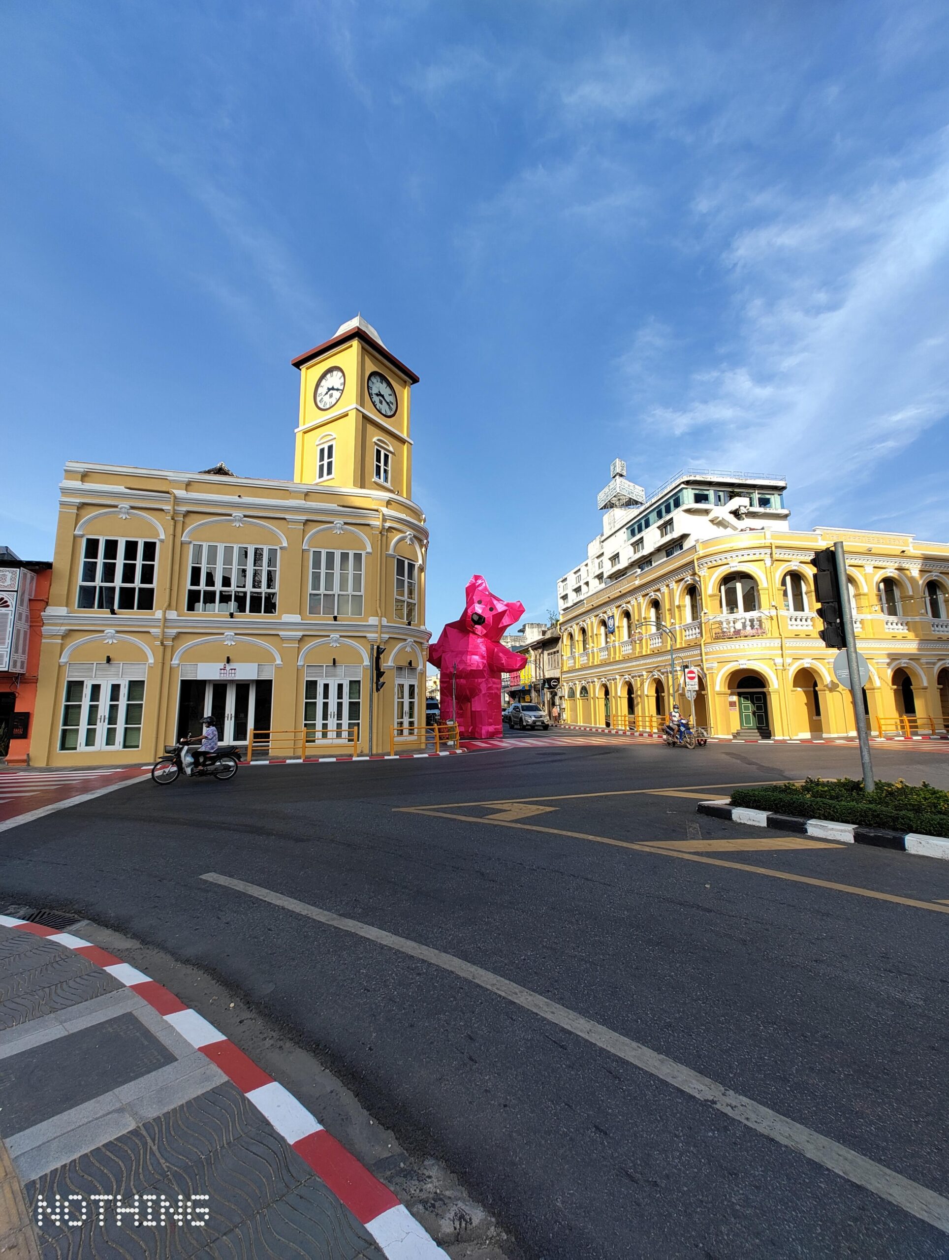Sino-Portuguese clock tower and heritage buildings at an Old Phuket Town intersection